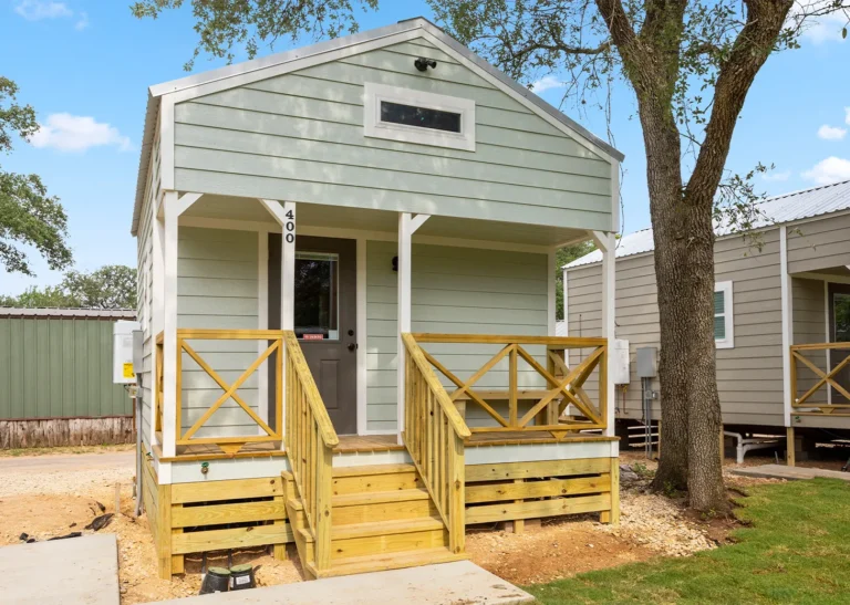 A Creekside Cabin with its front porch at Splashway Campground