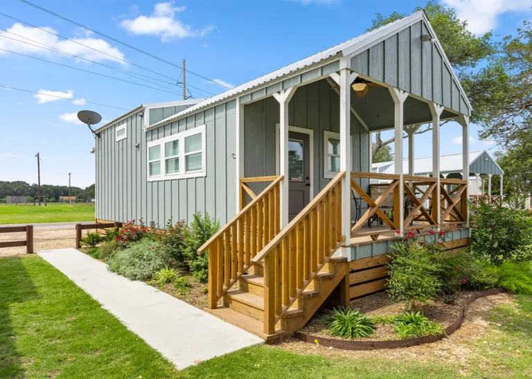 A King Cabin with its front porch at Splashway Campground