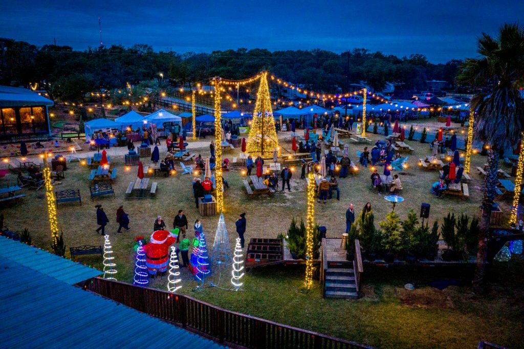 Splashway Campground decorated with Christmas lights and trees in the evening